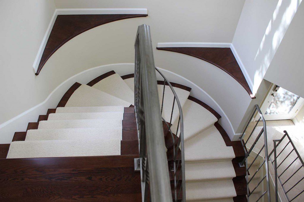 hardwood flooring installation with carpet on stairs